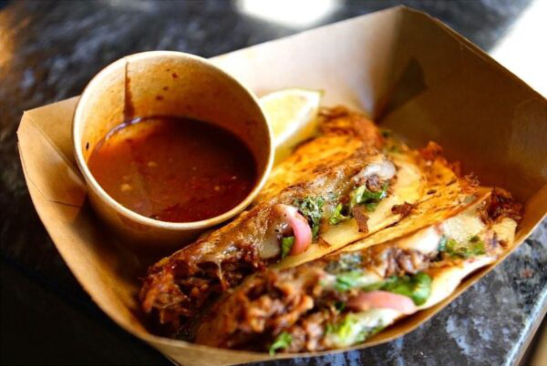 Quesabirria catering Waco - golden crispy quesabirria with melted cheese for weddings and events